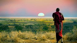 Tanzania Massai Man Wearing Traditional Blankets Overlooks Serengetti